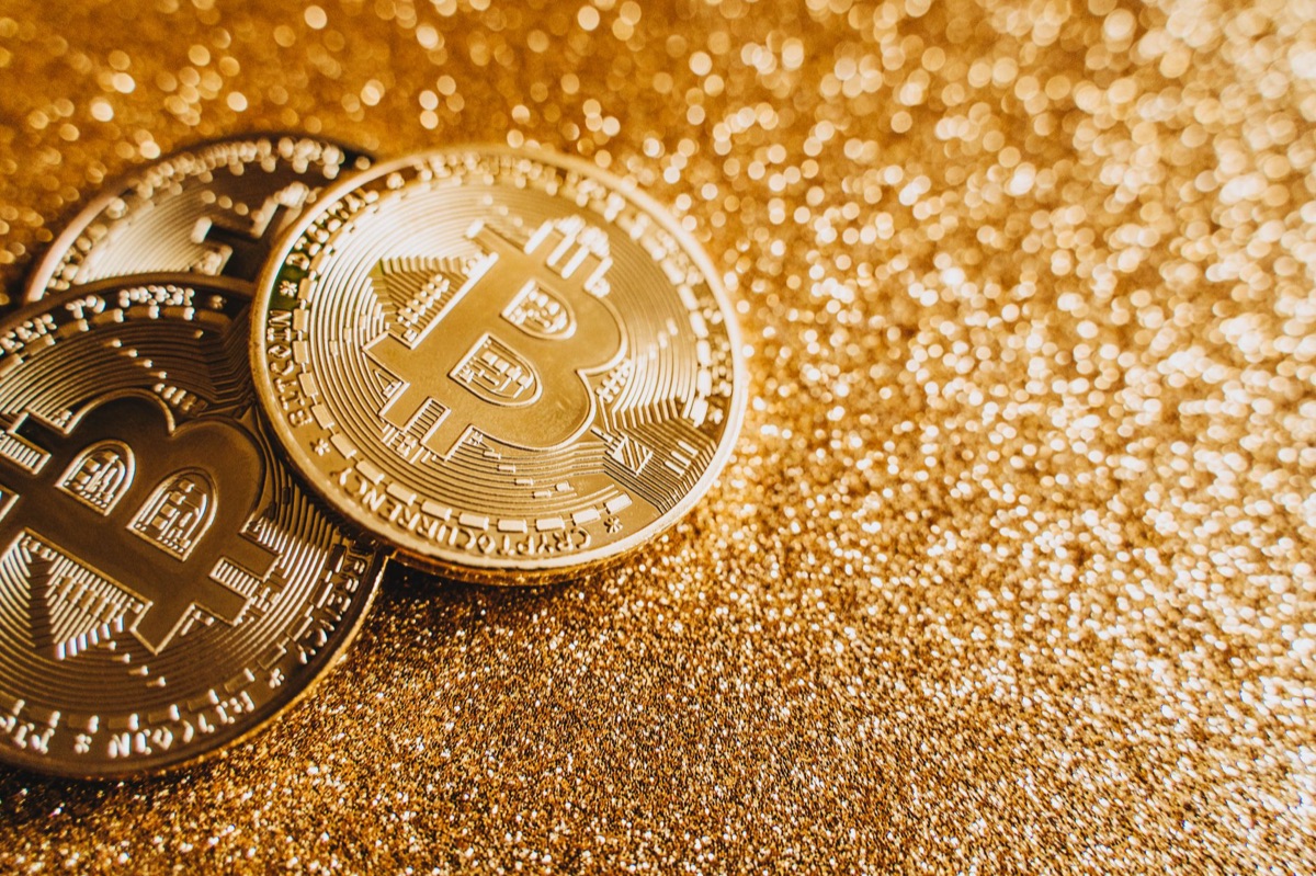 Bitcoin coin placed next to a legal gavel representing cryptocurrency regulation